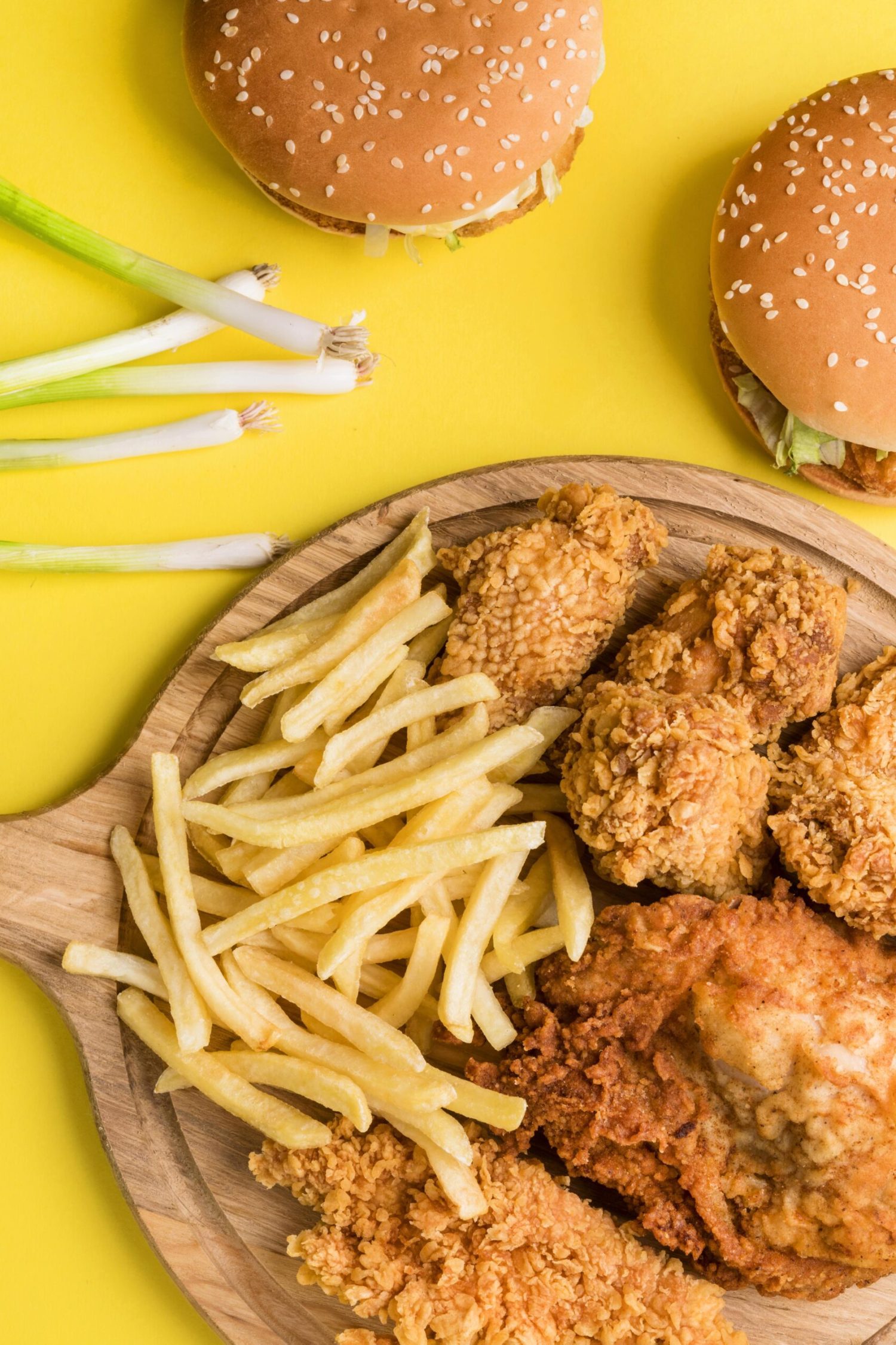 top-view-fried-chicken-fries-with-burgers-green-onions